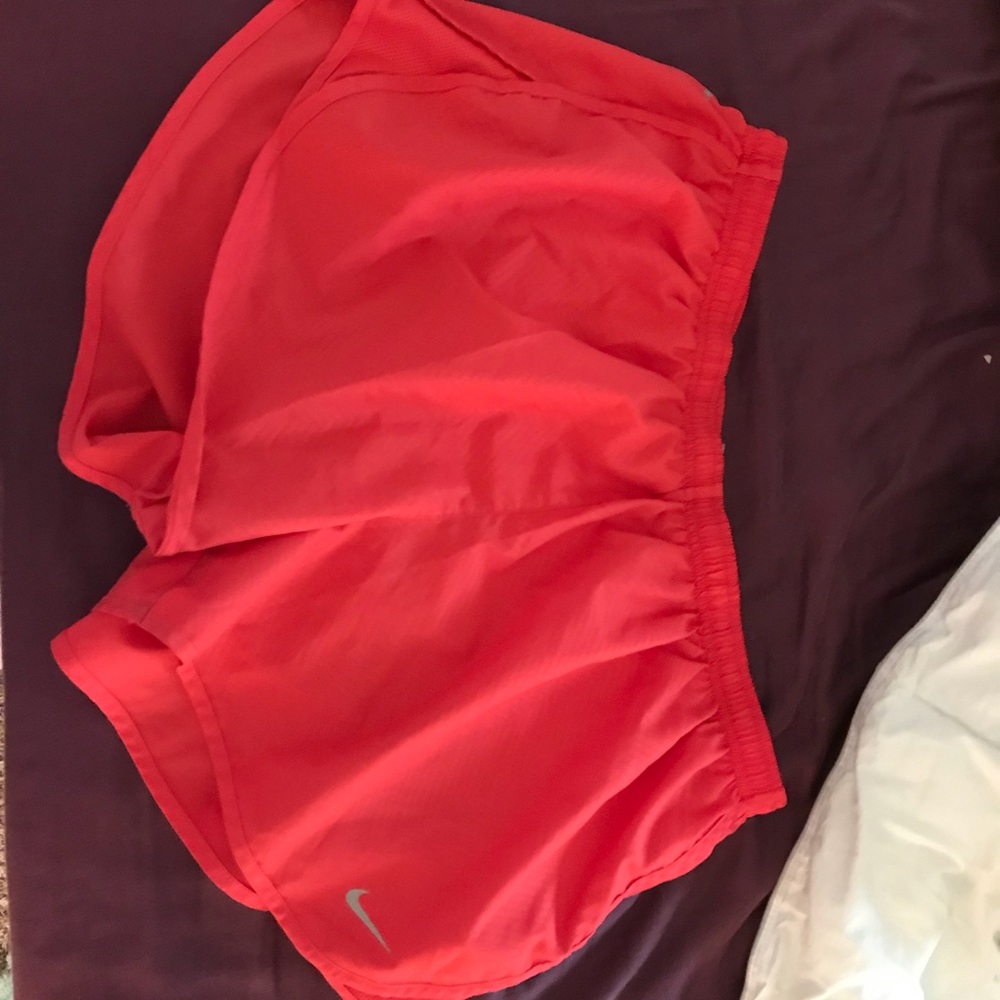 Red Nike shorts